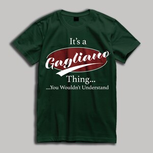 May include: A green t-shirt with a white graphic that says "It's a Gagliano Thing... You Wouldn't Understand". The graphic is in a red oval with a white outline.