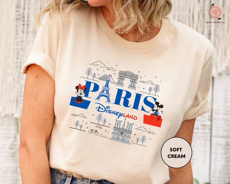 a woman wearing a t - shirt with the word paris on it