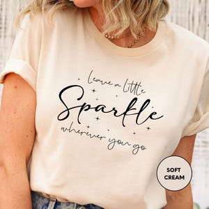 a woman wearing a t - shirt that says i love you little sparkle wherever you