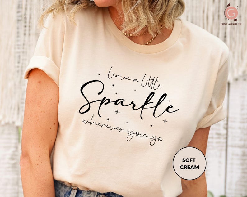 a woman wearing a t - shirt that says i love you little sparkle wherever you