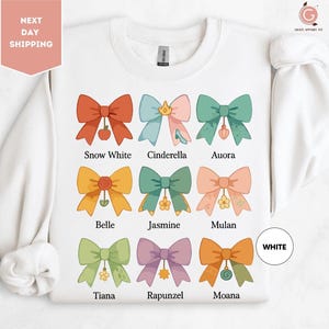 a white shirt with a bunch of bows on it