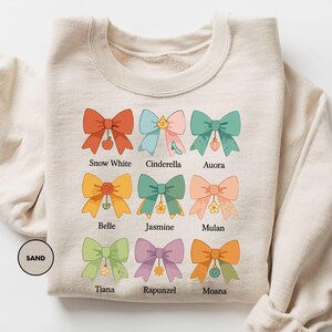 a white shirt with a bunch of bows on it