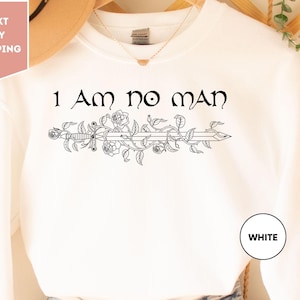 a white shirt that says i am no man on it