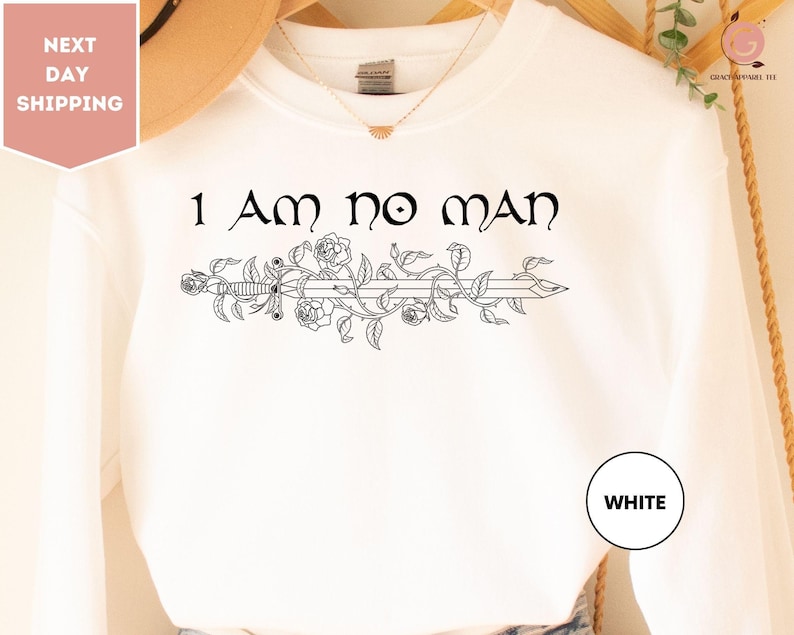 a white shirt that says i am no man on it