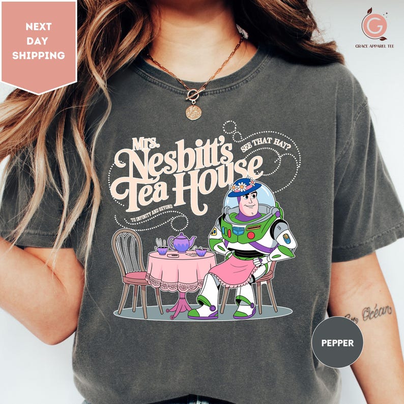 a woman wearing a tshirt with a cartoon character on it
