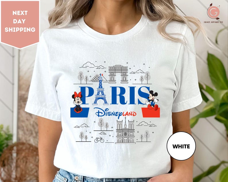 a woman wearing a white t - shirt with the words paris on it