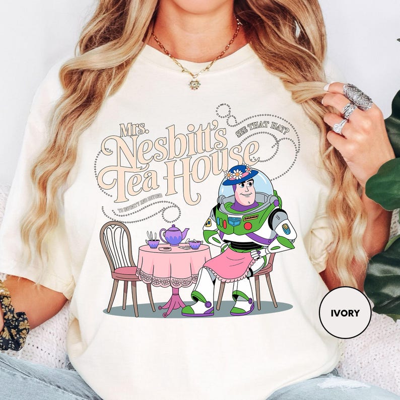 a woman wearing a t - shirt with a cartoon character on it