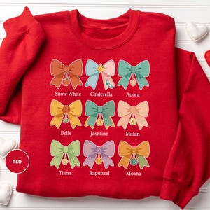 a red shirt with a bunch of bows on it