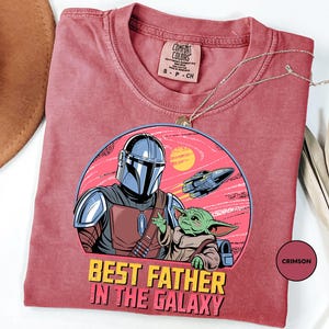 a t - shirt with a picture of a man in a helmet on it