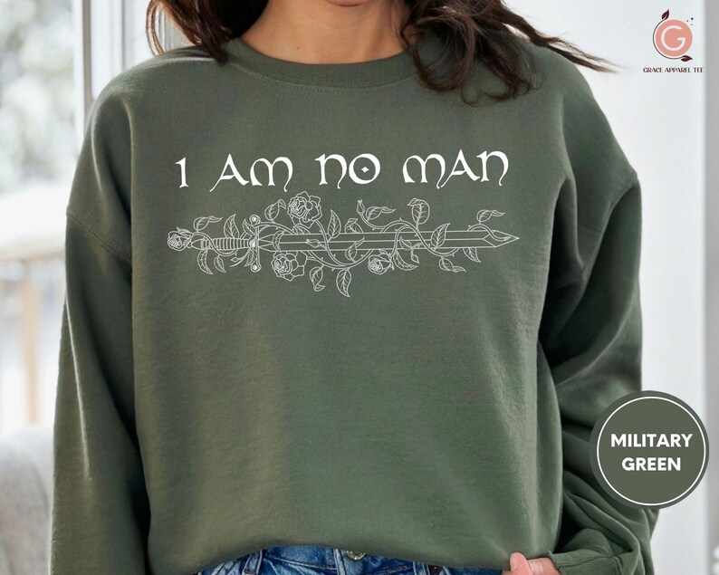 a woman wearing a sweatshirt that says i am no man