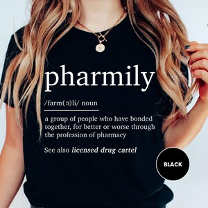 a woman wearing a black t - shirt with the words pharmily on it