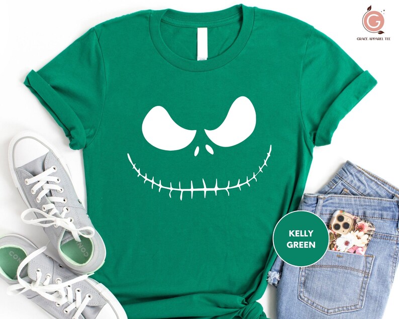 a green shirt with a jack skelling face on it