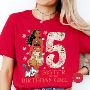 A red t-shirt with a cartoon image of a young girl and the number 5, along with the text "Sister of the Birthday Girl".