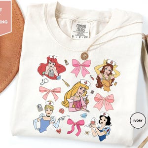 Comfort Colors Coquette Bows Disney Princesses Nurse Shirt, Nursing School Shirt, Disney Nurse Shirts, Women Disney Trip Shirt, Disney Shirt