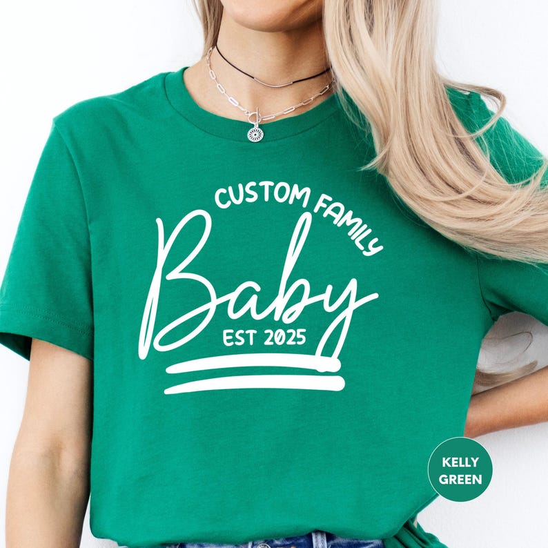a woman wearing a green t - shirt with a crown on it