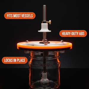 May include: A candle wick centering tool with a white and orange circular frame, a vertical metal rod, and a white adjustment knob. Text reads: TIRED OF UNEVEN WICKS? CENTER PERFECTLY EVERY TIME. FITS MOST VESSELS. HEAVY-DUTY ABS. LOCKS IN PLACE. SHOP WICK SETTER.