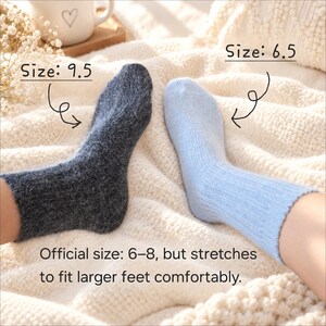 May include: A pair of fuzzy socks in dark gray and light blue. The dark gray sock is labeled Size: 9.5 and the light blue sock is labeled Size: 6.5. Text below states: Official size: 6&ndash;8, but stretches to fit larger feet comfortably.