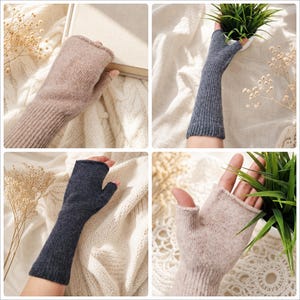 May include: A collection of fingerless gloves in beige and dark gray colors. These knitted arm warmers feature a ribbed texture, a thumb hole, and an open-finger design. The fabric has a soft, fuzzy appearance, providing coverage from the wrist up to the knuckles, showcasing a simple and functional construction for hand warmth.