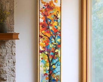 Puede incluir: Un cuadro vertical y rectangular sobre lienzo que muestra un árbol abstracto con pinceladas gruesas y texturizadas en tonos vibrantes de rojo, naranja, amarillo y azul, enmarcado en un marco de madera fina y clara.
