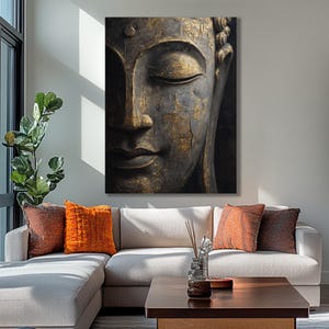 a large Buddha statue with a serene expression, mounted on a wall above a white sectional sofa adorned with orange and red throw pillows.