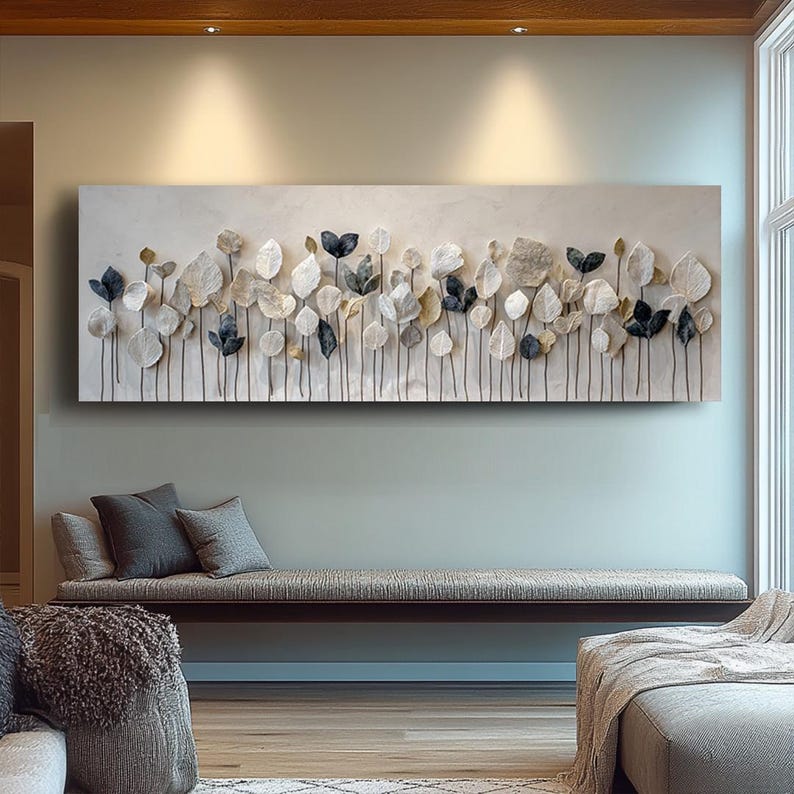 a large, rectangular wall art piece with a floral design, hanging above a seating area in a modern living room.