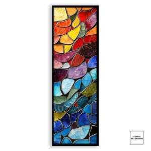 May include: Abstract mosaic art print in a black frame. The artwork features irregular shapes in shades of red, orange, yellow, purple, blue, and green. The print is a vertical rectangle, with the words "Eternal Art Designs" in the bottom right corner.