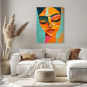 a living room with a couch and a painting on the wall