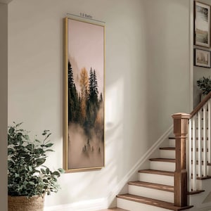 May include: A tall, vertical rectangular wall art piece in a thin gold frame featuring a misty forest landscape with dark green pine trees and a single golden-yellow tree. The artwork is labeled with the text 1:3 Ratio at the top center.