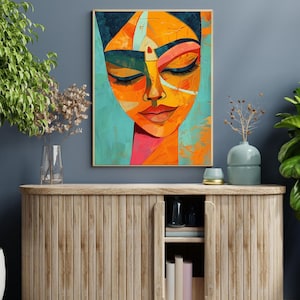 a painting of a woman's face on a blue wall