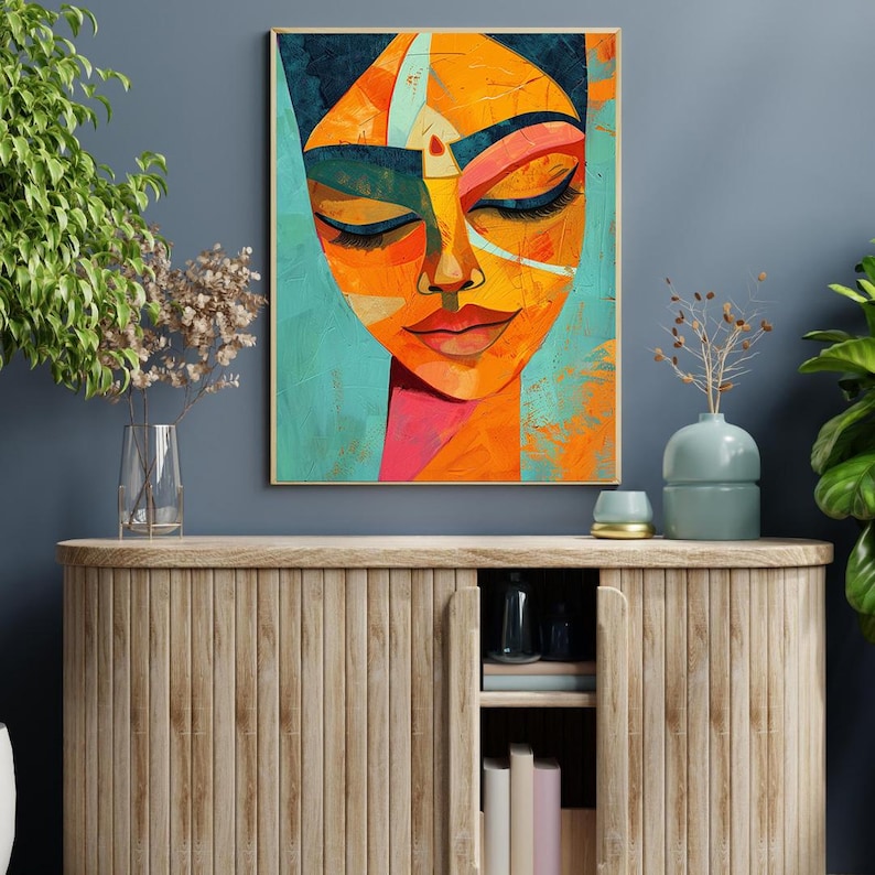 a painting of a woman's face on a blue wall