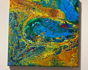 12in by 12in white, Orange, Green, Red, Blue acrylic canvas pour painting.