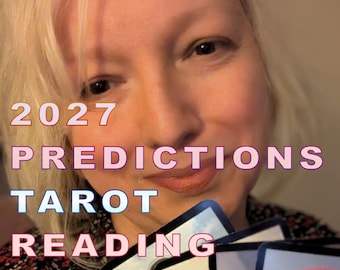 May include: A person with blonde hair wearing a dark floral patterned top, holding a fan of four tarot cards. The text 2027 PREDICTIONS TAROT READING is overlaid in white with a pink outline, featuring a card showing a rainbow and figures.