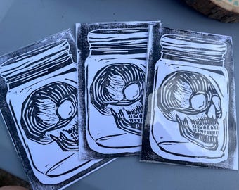 Skull in a jar - block print linocut