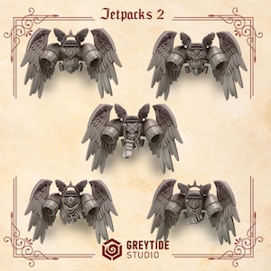 Puede incluir: Cinco mochilas cohete grises con estructuras en forma de alas y motores cilíndricos. El texto "Jetpacks 2" está en la parte superior y el logotipo "GREYTIDE STUDIO" en la parte inferior. Las mochilas cohete tienen diseños mecánicos detallados.