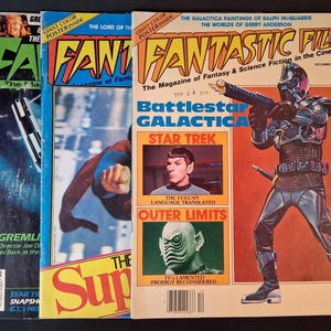 May include: Three vintage Fantastic Films magazines from December 1978. The covers feature colorful illustrations and photographs of Battlestar Galactica, Star Trek, and Superman. The text includes titles, issue dates, and various science fiction themes.