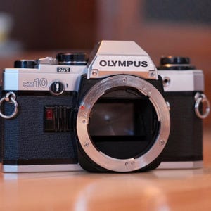 Olympus OM10 35mm film SLR body - tested and working (including light meter)