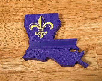 Louisiana fleur-de-lis phone stand.