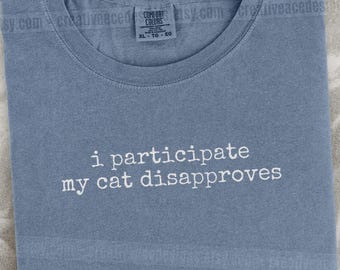 I Participate My Cat Disapproves Shirt Funny Cat Humor Shirt Cat Mom Shirt Cat Dad Tee Gift For Cat Owners Four Legged Word
