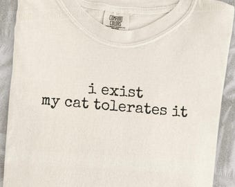 I Exist My Cat Tolerates It Shirt Funny Cat Humor Shirt Cat Mom Shirt Cat Dad Tee Gift For Cat Owners Four Legged Word
