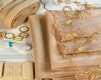 Puede incluir: Un conjunto de tela y ribete beige y dorado para proyectos de costura. El conjunto incluye encaje, tul, elástico y tirantes de sujetador.
