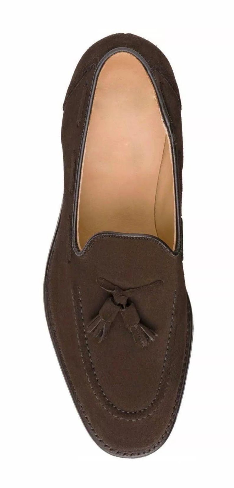 May include: Brown suede tassel loafers with a stitched design.