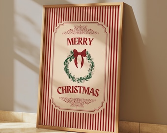 May include: A framed Christmas print with a red and white striped background. The print features the words "MERRY CHRISTMAS" in red, surrounding a green wreath with a red bow. The frame is made of wood.