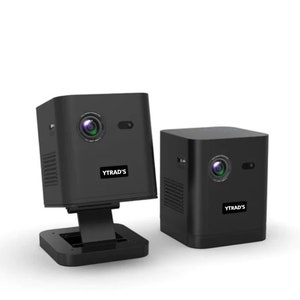 May include: Two black mini projectors with built-in cameras. Both projectors have a small speaker grill on the side and the text "YTRAD'S" printed on the front. One projector is on a black stand.