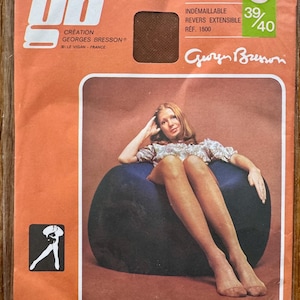 May include: Vintage package of sheer nylon stockings. The package is orange with the brand name "gb" in white. The text "CREATION GEORGES BRESSON" is visible. The package features an image of a woman wearing the stockings. The size is 39/40.