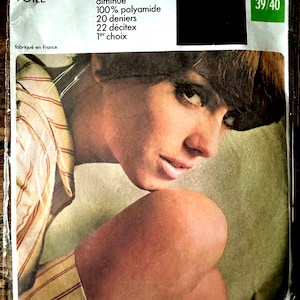 May include: A package of sheer stockings with a model wearing a striped shirt. The package features the brand name "BAS VOILE" and details about the stockings, including "sans couture talon renforcé, diminué 100% polyamide 20 deniers 22 décitex 1er choix". The package also includes the size "TAILLE 3 39/40".
