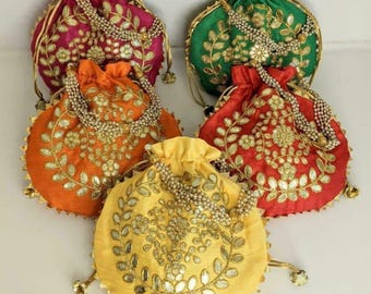 Handmade potli bag with drawstring closure, perfect for weddings, festivals, parties, and ethnic gifting.