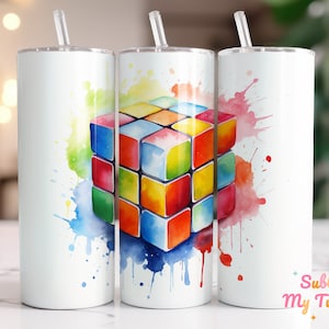 May include: Three white stainless steel tumblers with a colorful watercolor design of a Rubik's cube. The design features splashes of pink, yellow, blue, green, and red.