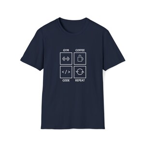 May include: Navy blue t-shirt with a white graphic of a four-square grid. Each square has a white icon and text. The top left square says "GYM" and has a dumbbell icon. The top right square says "COFFEE" and has a coffee cup icon. The bottom left square says "CODE" and has a less than and greater than symbol. The bottom right square says "REPEAT" and has a circular arrow icon.