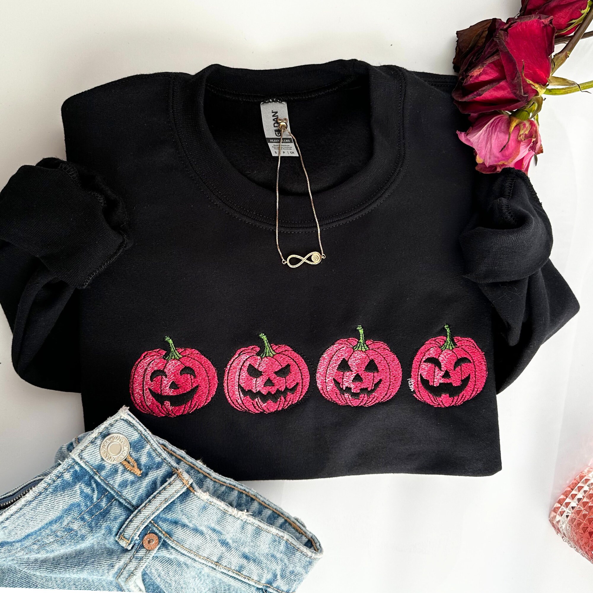 Discover Embroidered Pink Spooky pumpkin Face Crewneck sweatshirt, Halloween Crewneck Sweatshirt, Halloween Sweater, Spooky Season