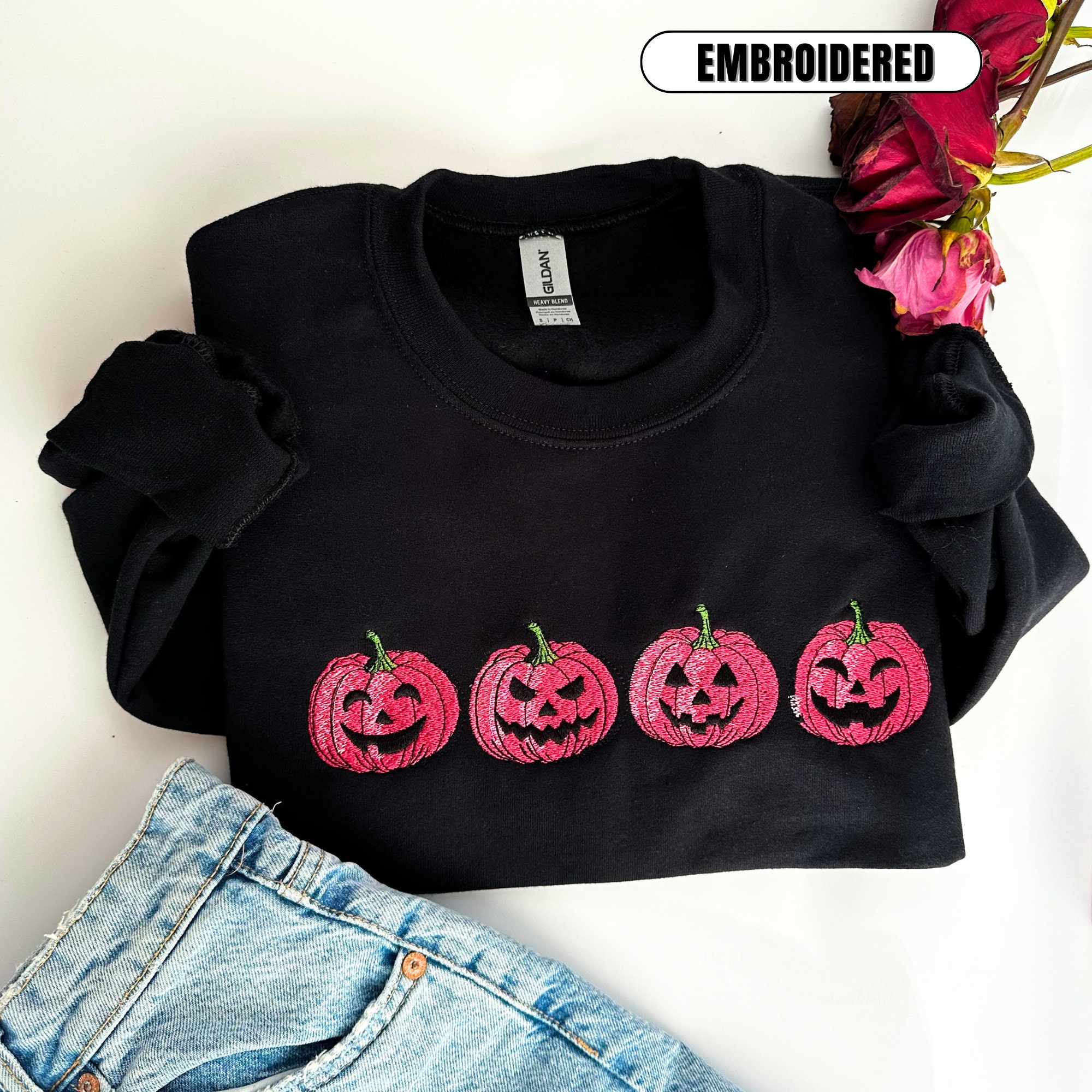 Discover Embroidered Pink Spooky pumpkin Face Crewneck sweatshirt, Halloween Crewneck Sweatshirt, Halloween Sweater, Spooky Season